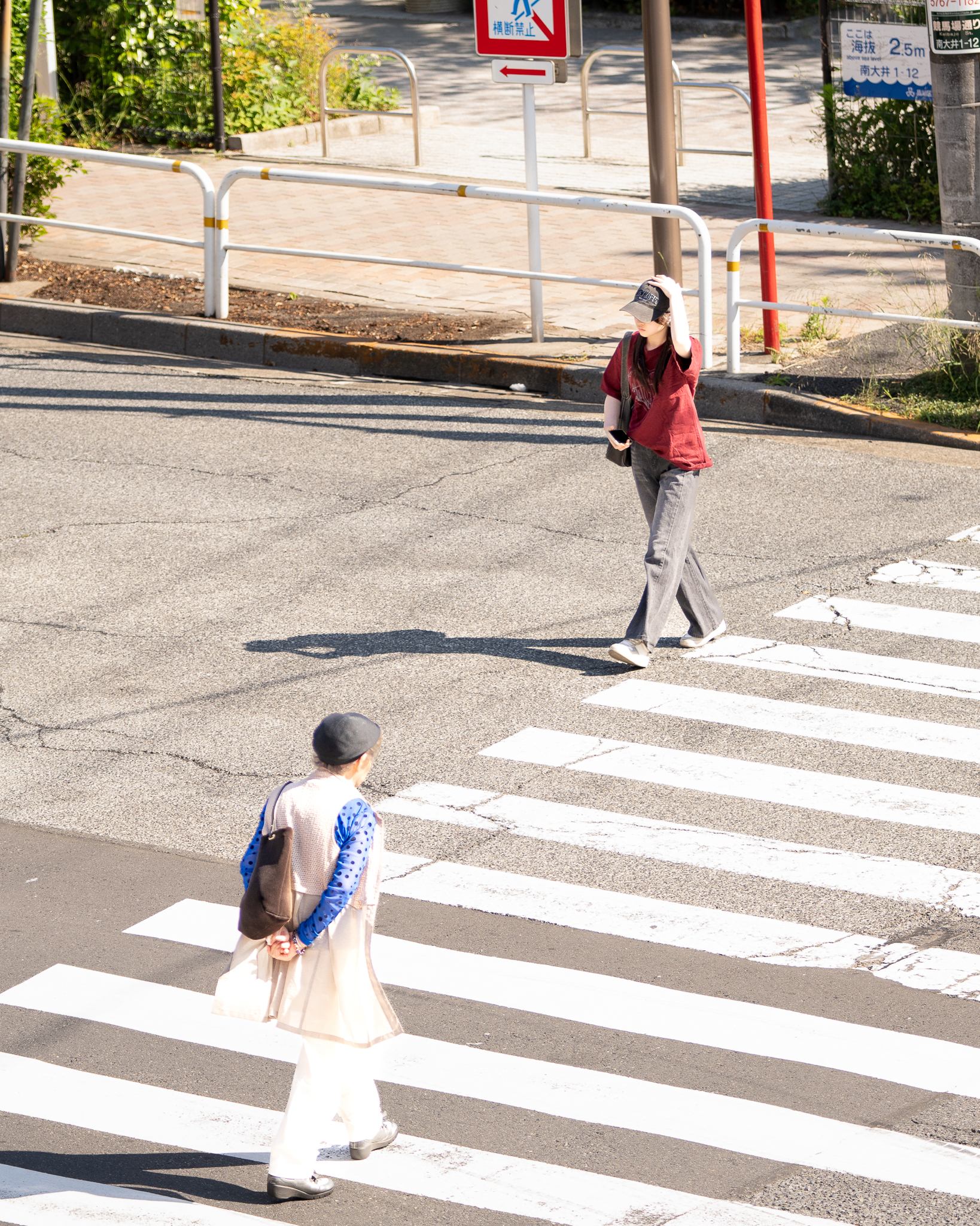 Candid street photograph, frame 5 of 14